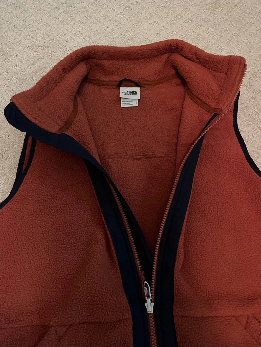 The North Face: Men's Burnt Orange Fleece Vest with Contrast Trim